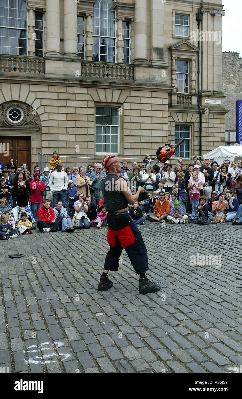 Chainsaw juggler hires stock photography and images Alamy