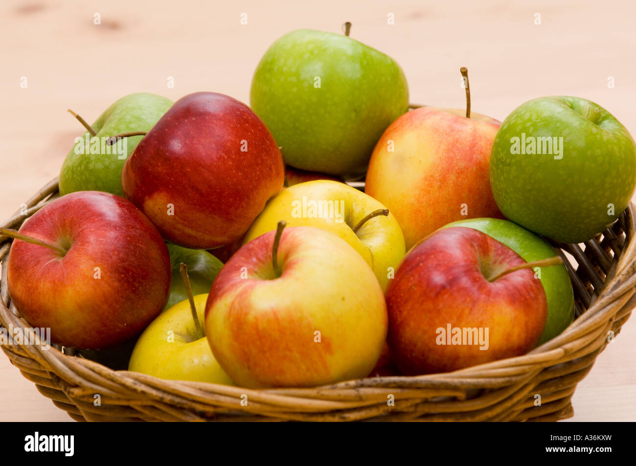 Diverse apples in a basket Stock Photo - Alamy