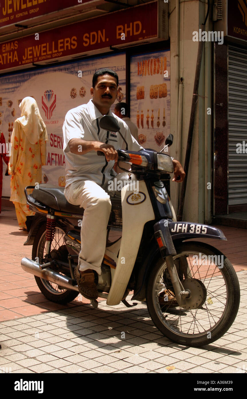 Malaysia Kuala Lumpur Masjid Jamek Market Local Biker on Motor Scooter