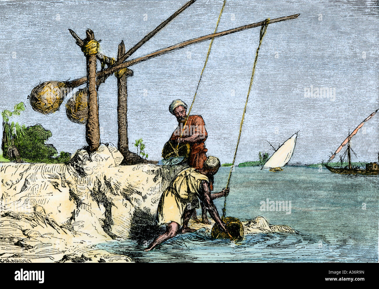 Egyptians along the Nile drawing water with a shadoof a counterbalanced device used since ancient times. Hand-colored woodcut Stock Photo