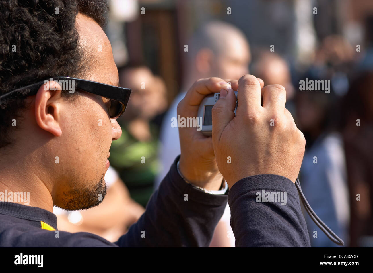Man taking a picture with his digital camera. Stock Photo