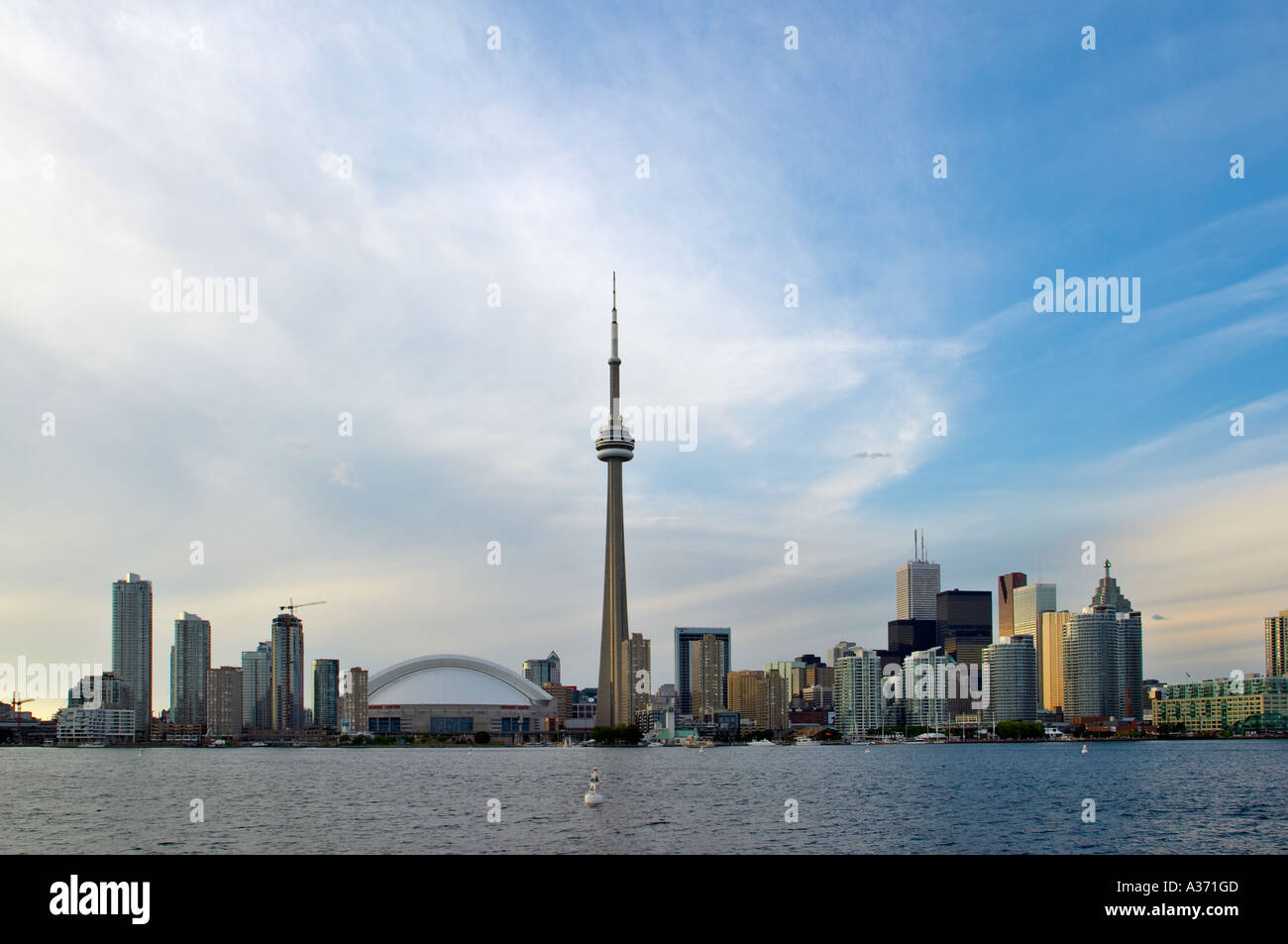 Toronto skyline against natural fantastic-looking sky. View from the Toronto islands across lake Ontario. Stock Photo