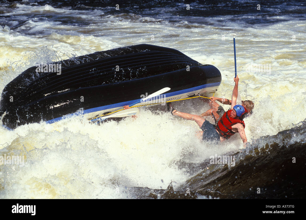Two rafters being thrown out of a raft in the rapids Stock Photo - Alamy