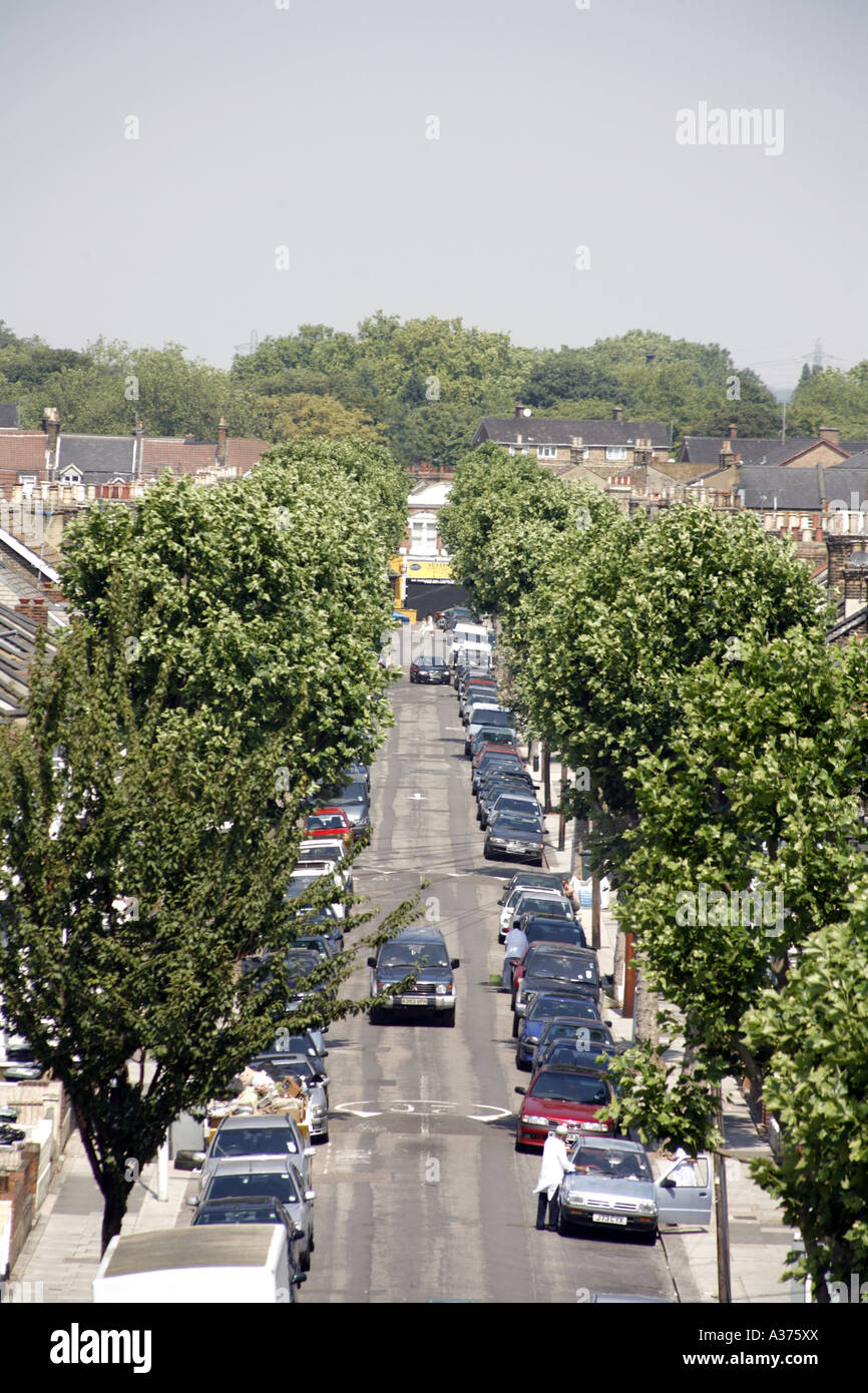 Aerial View of a Tree Lined Residential Street in East London England with speed bumps and cars parked on both sides Stock Photo