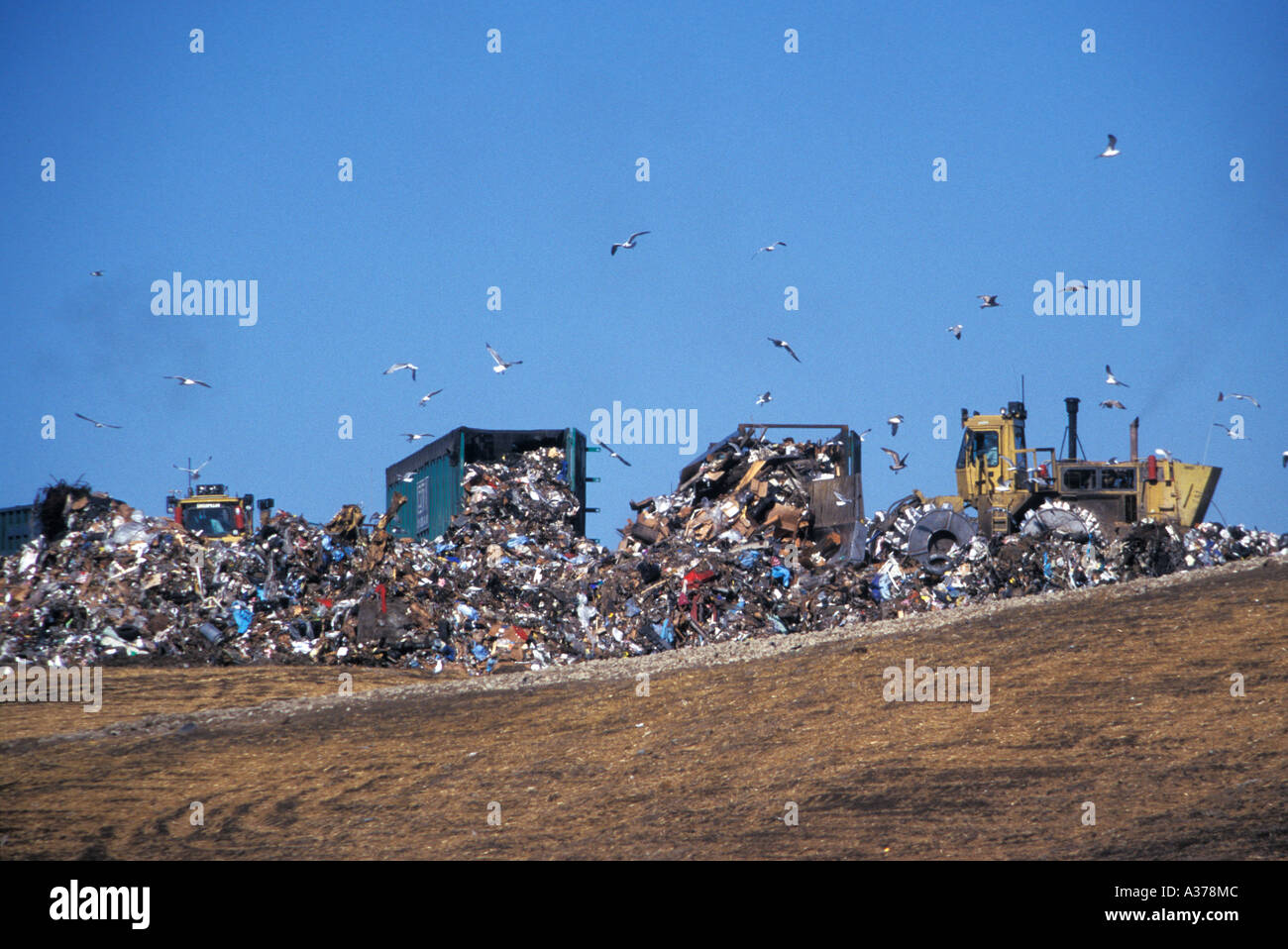 Waltz Michigan Trucks dump trash at the Carlton Farms Landfill near Detroit Stock Photo