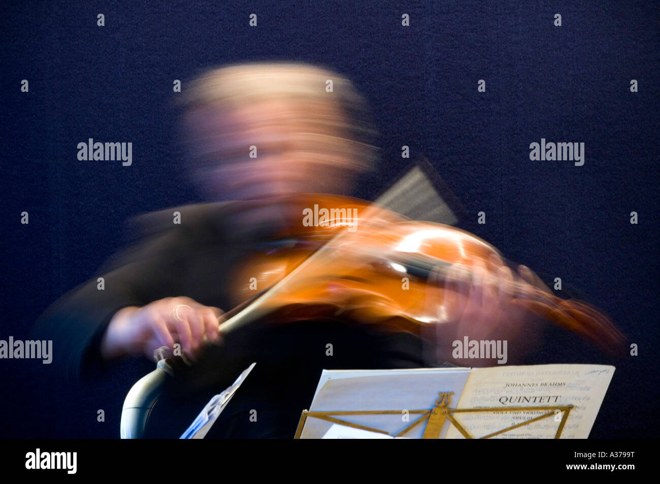 Violinist plays the Johannes Brahms Quintet for violin and viola. Member of the Hamburger Symphoniker in Hamburg, Germany. Stock Photo