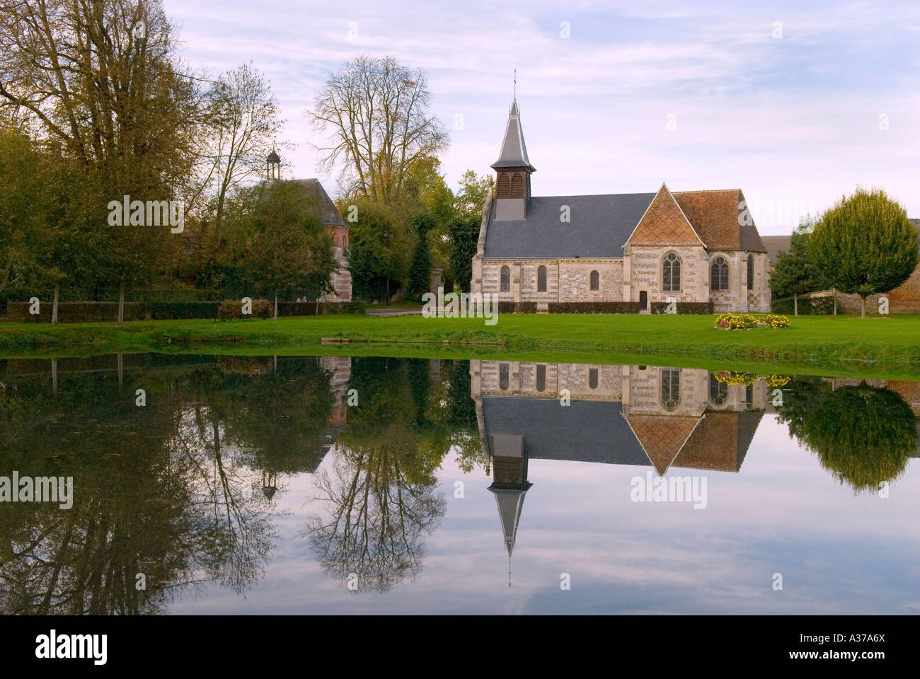 Normandy Church Reflected in Pond Stock Photo Alamy