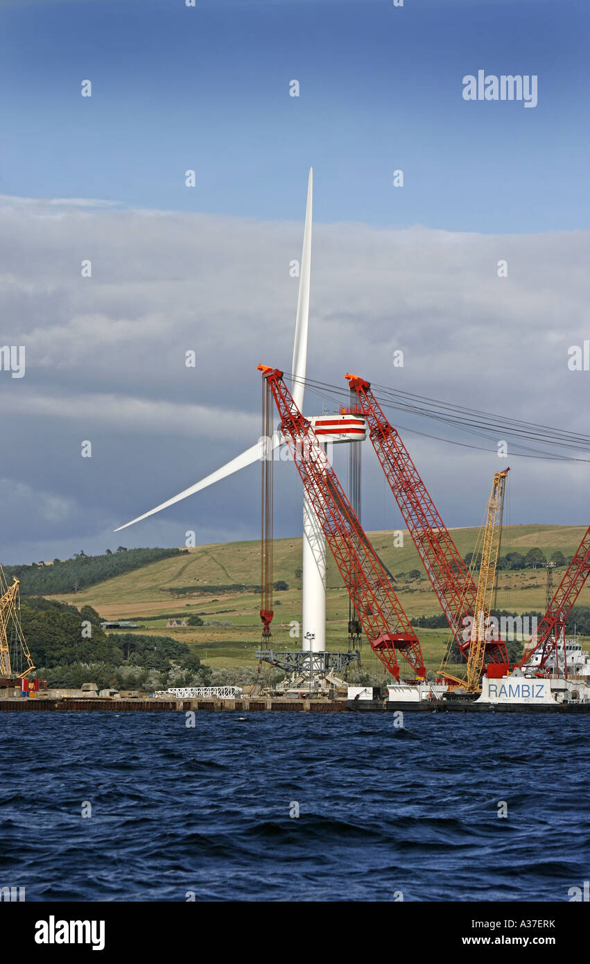 A Wind Turbine being loaded onto the lifting barge Rambiz before being towed out to the Talisman Field in the Moray Firth for tr Stock Photo