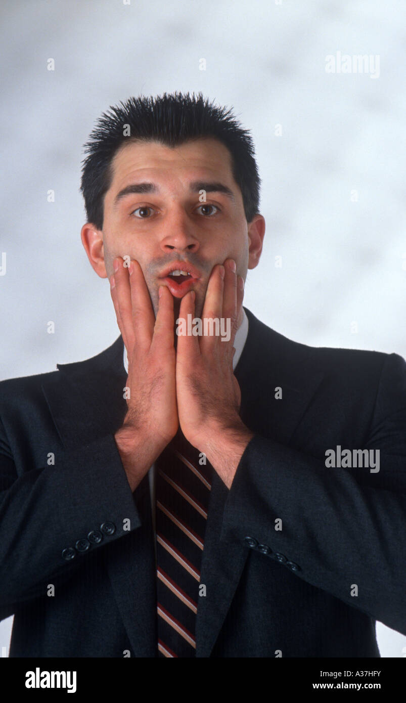 Businessman looks surprised Stock Photo