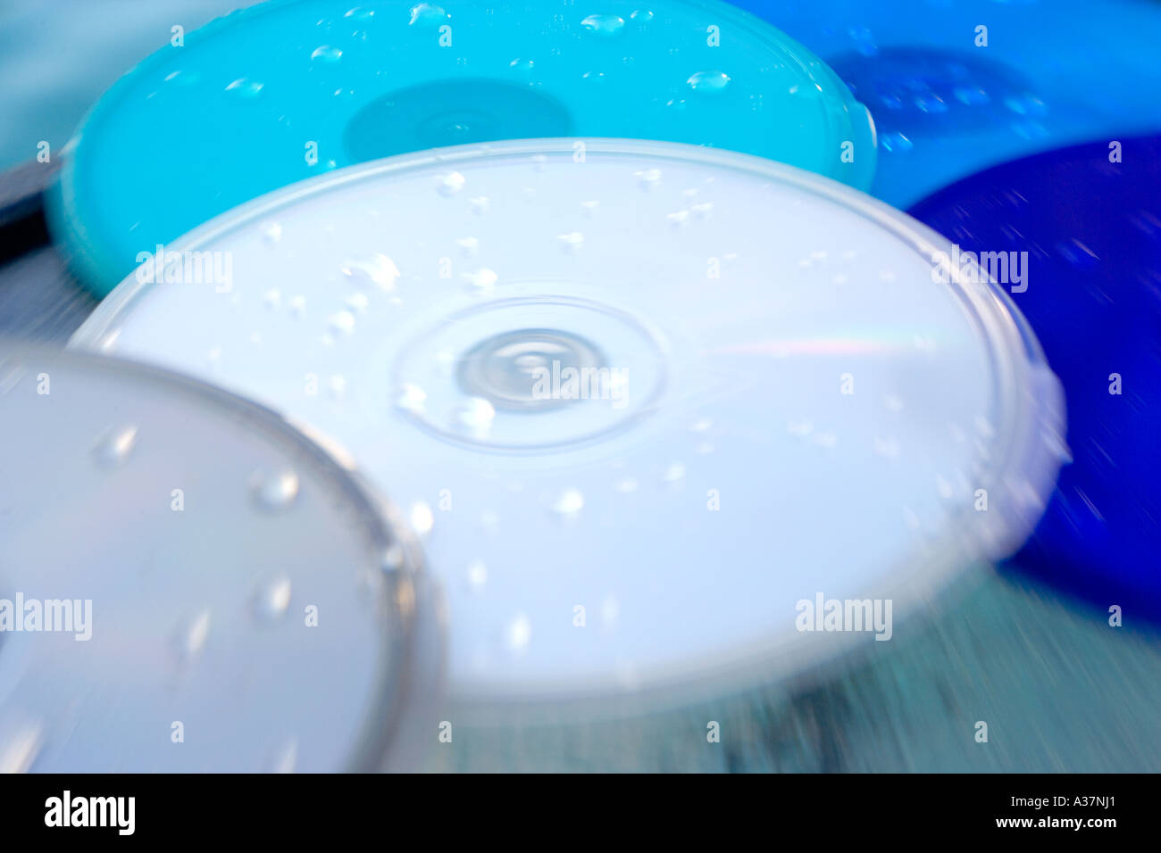 CD DVD containers PODZ product beside pool splashed with water Stock Photo