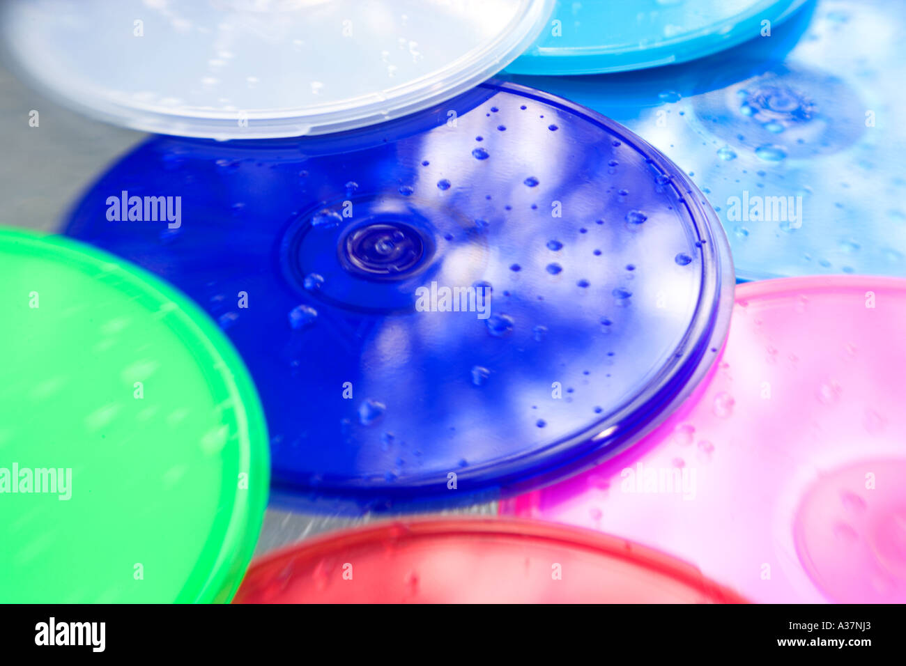 CD DVD container PODZ product beside pool splashed with water Stock Photo