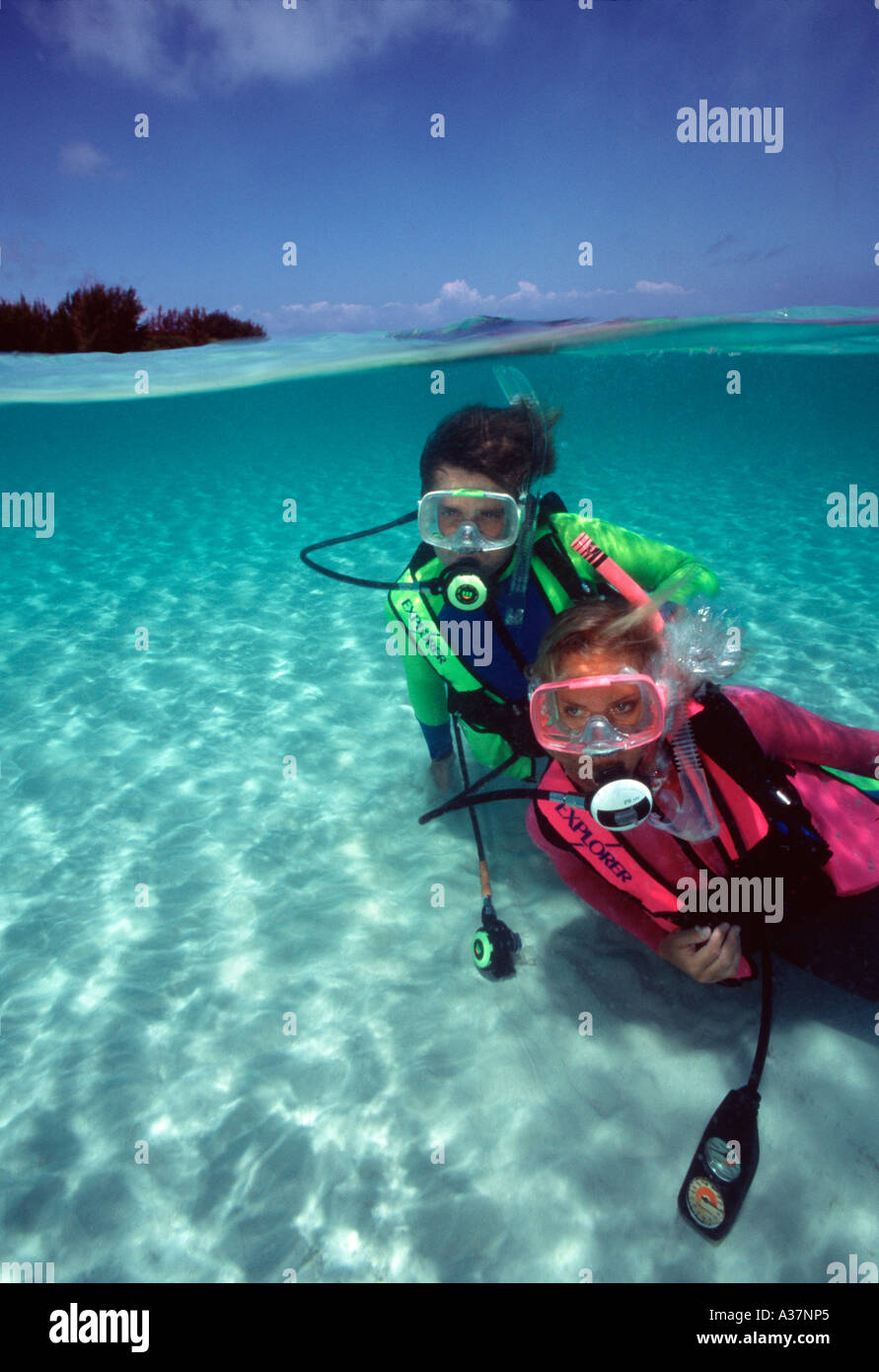 Scuba divers underwater in under over picture Nassau Bahamas Islands Caribbean Stock Photo Alamy