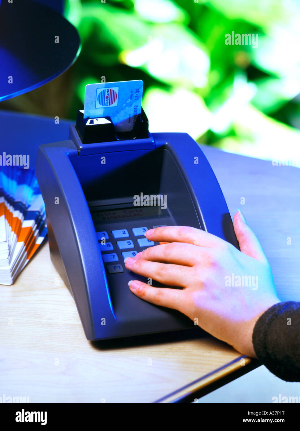 Bargeldlose Bezahlung, Paying with Credit Card EC Card at a Terminal Stock Photo