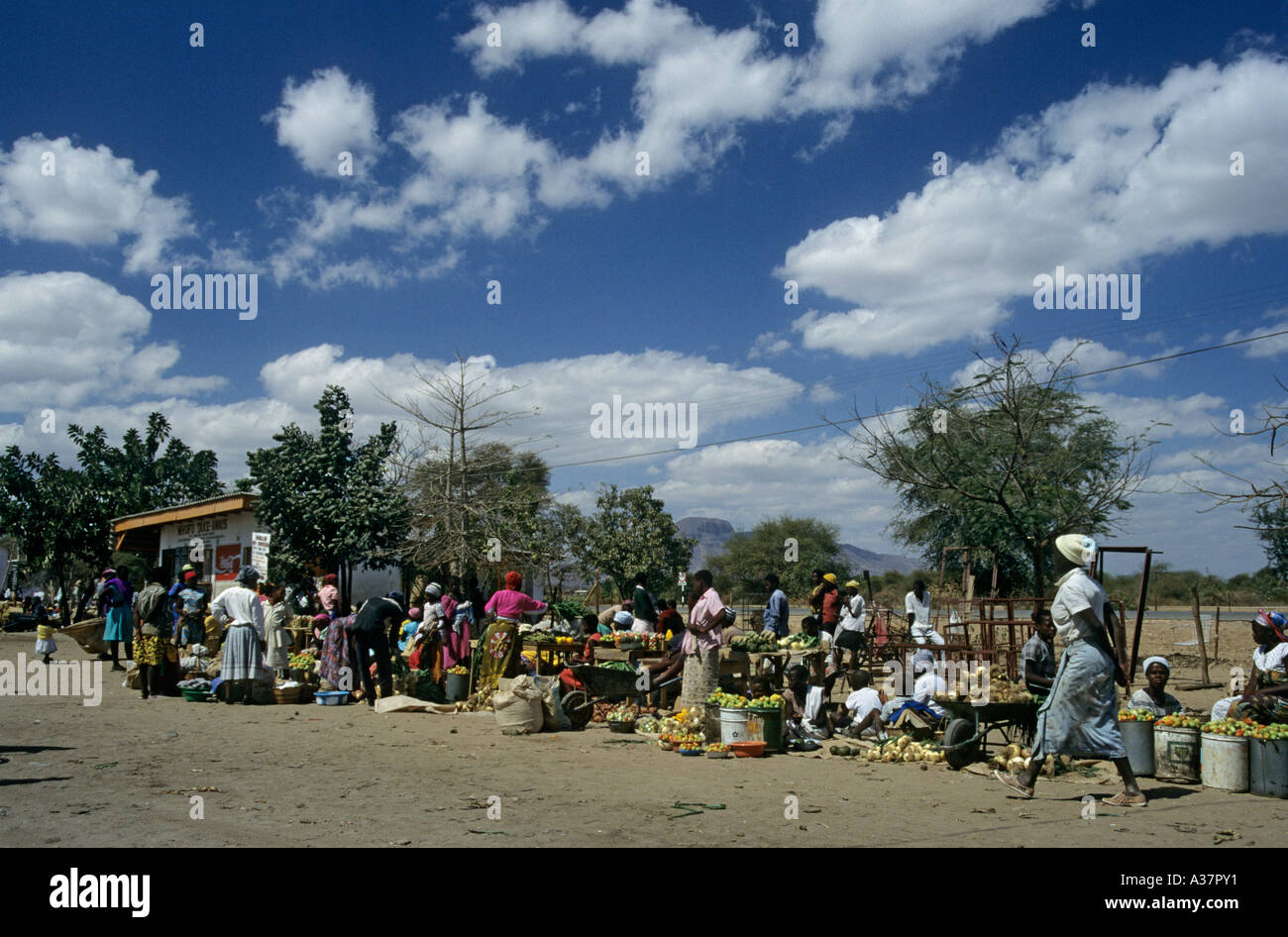 Produce on sale in market at side of road with take away stall Zimbabwe Africa Stock Photo