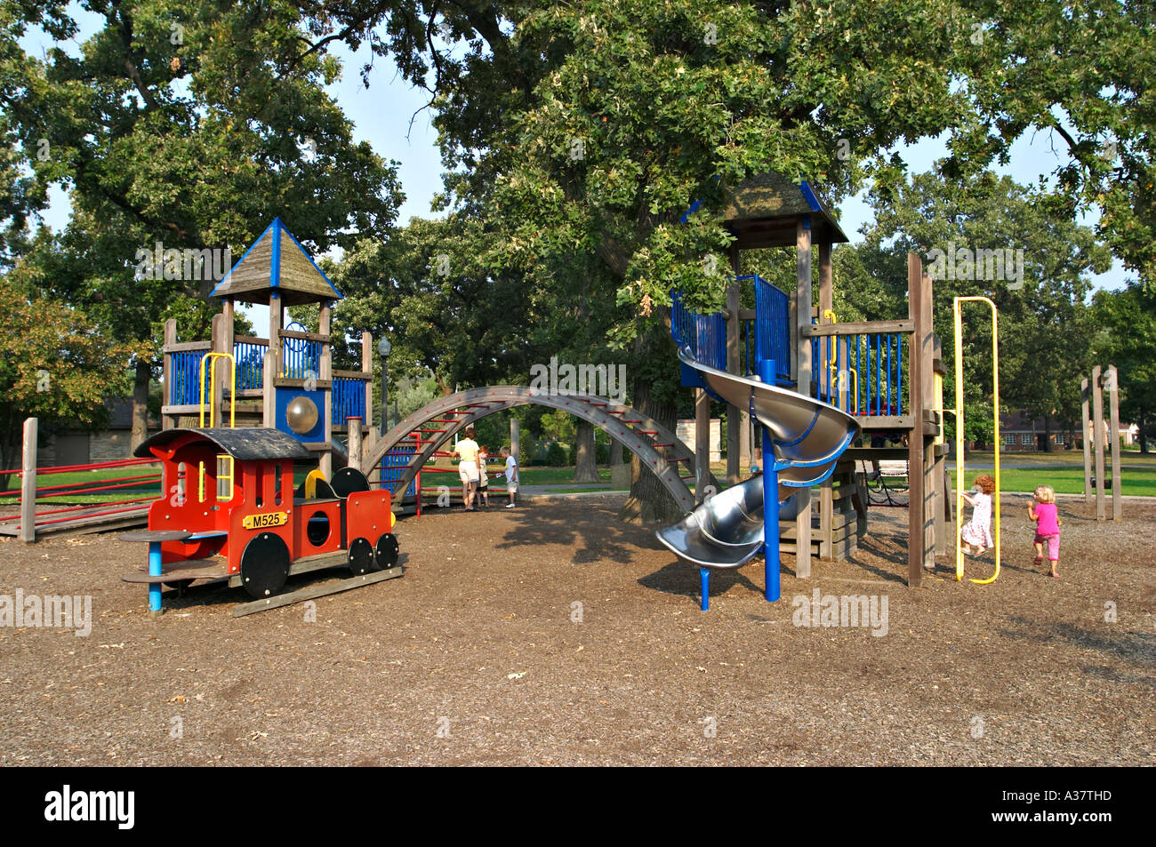 ILLINOIS Northbrook Wooden playground with several pieces of equipment slide train pole arch