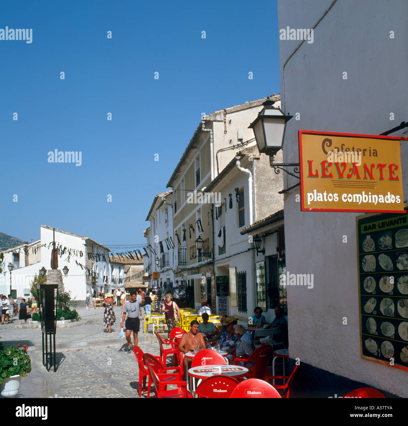 Sidewalk cafe in the  Moorish mountaintop village of Guadalest, near Benidorm, Costa Blanca, Spain Stock Photo