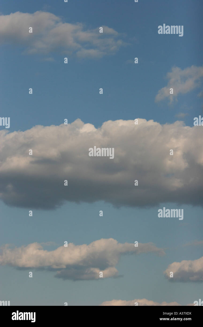 Puffy white clouds with a light blue sky Stock Photo - Alamy