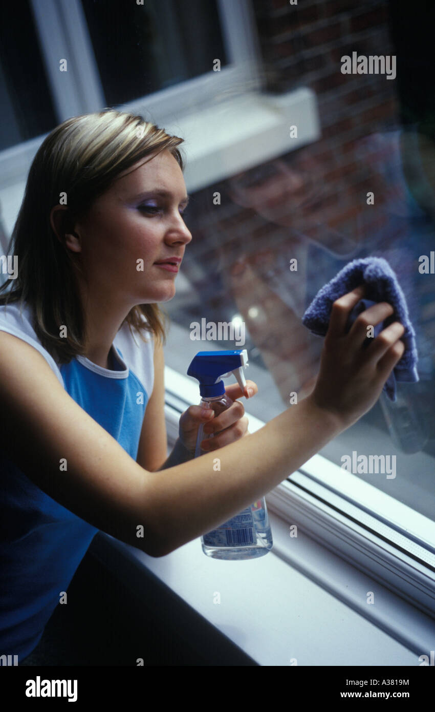 woman cleaning a window Stock Photo