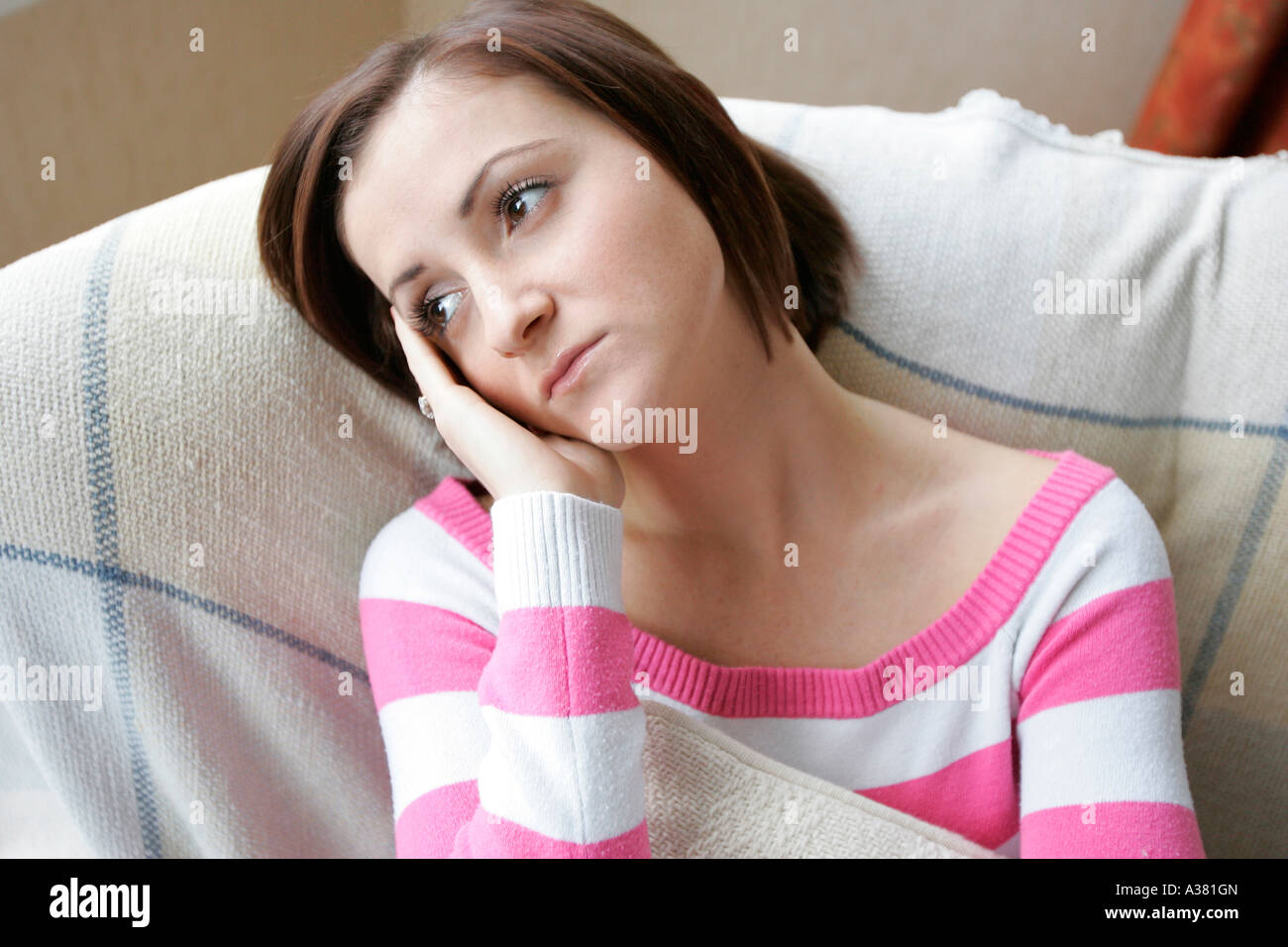 woman with head in hands Stock Photo