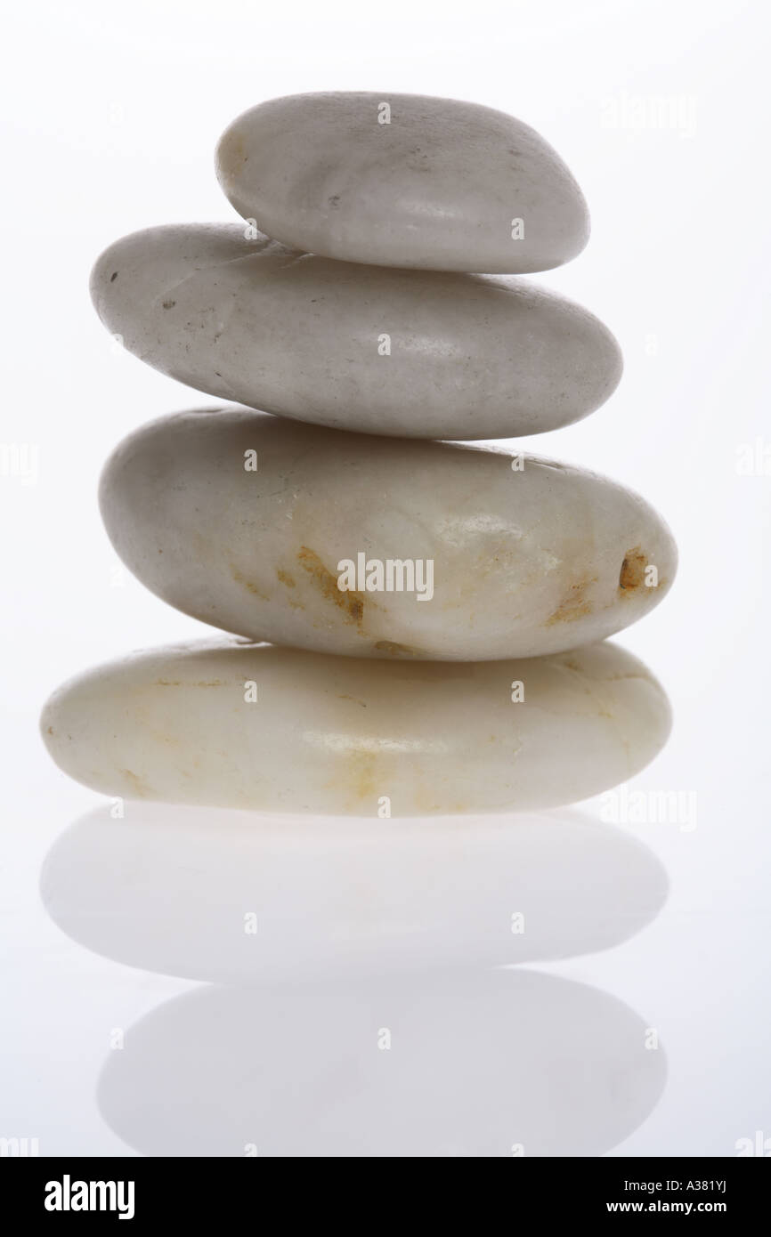 Stack of Rocks on Reflective Surface Stock Photo