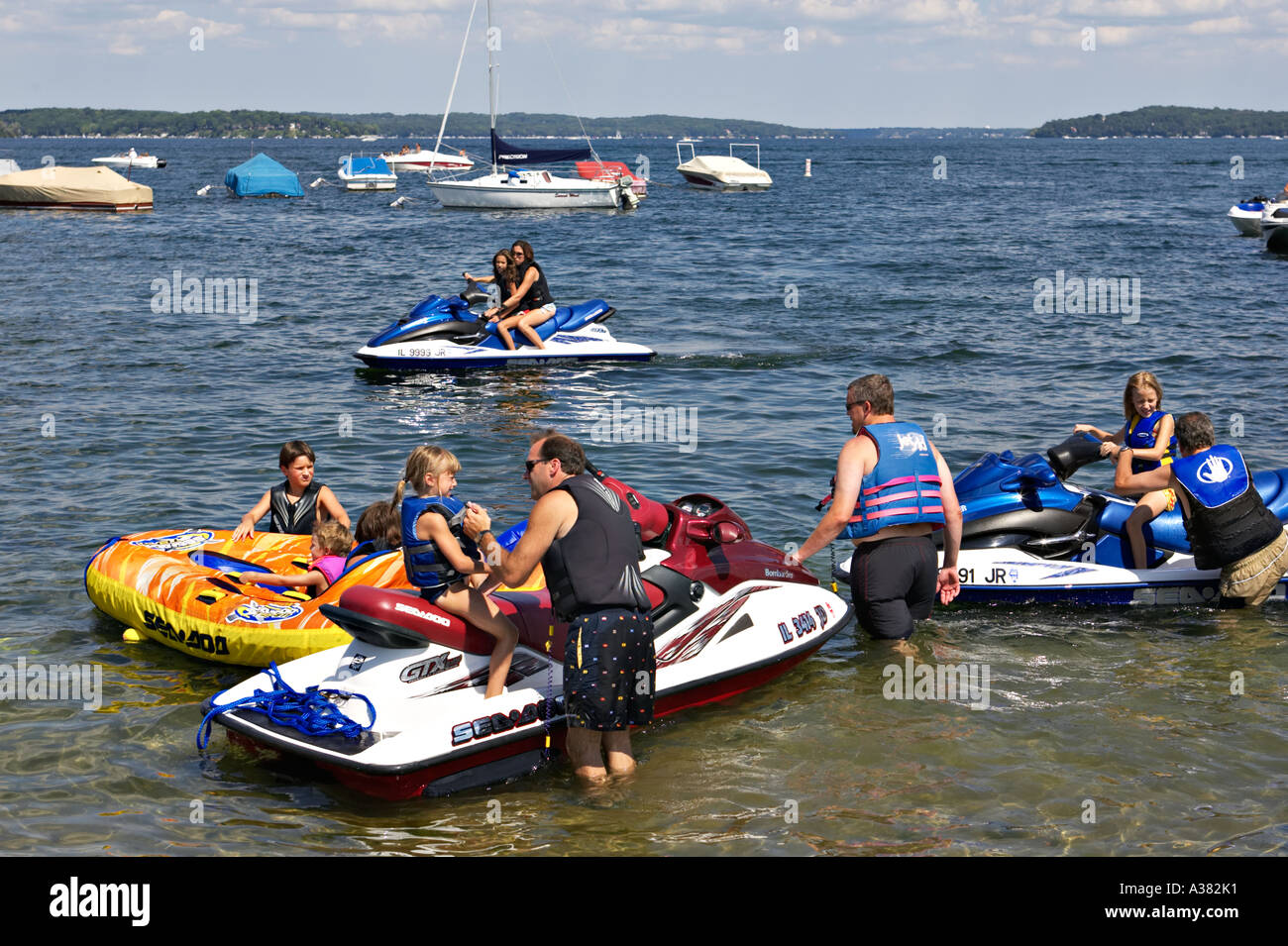 WISCONSIN Fontana Small town marina on Lake Geneva popular vacation  destination boating and jetskis family together Stock Photo - Alamy