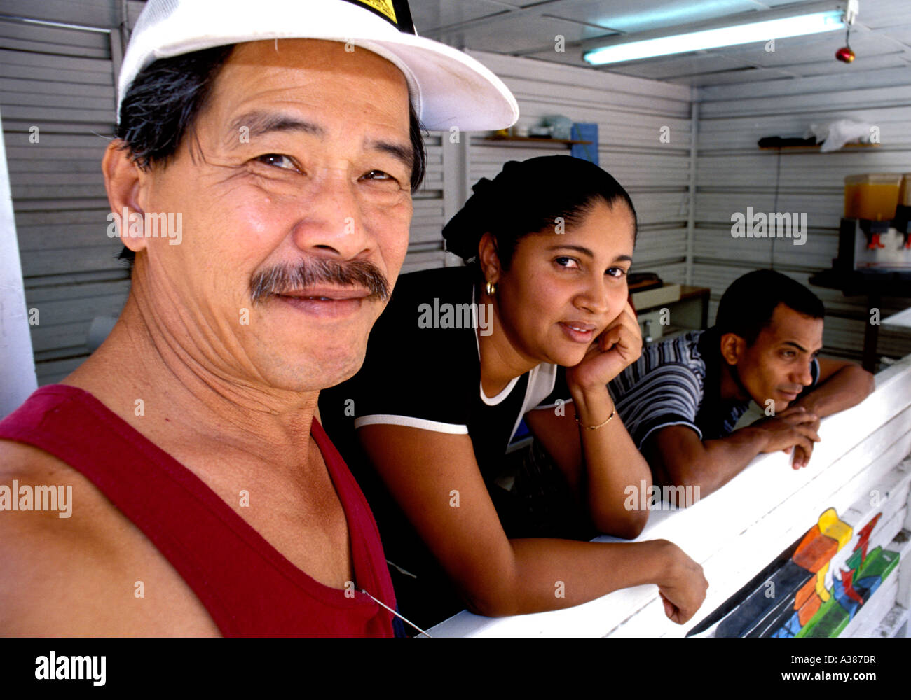 A Chinese Cuban man hangs out with friends in Havana Stock Photo