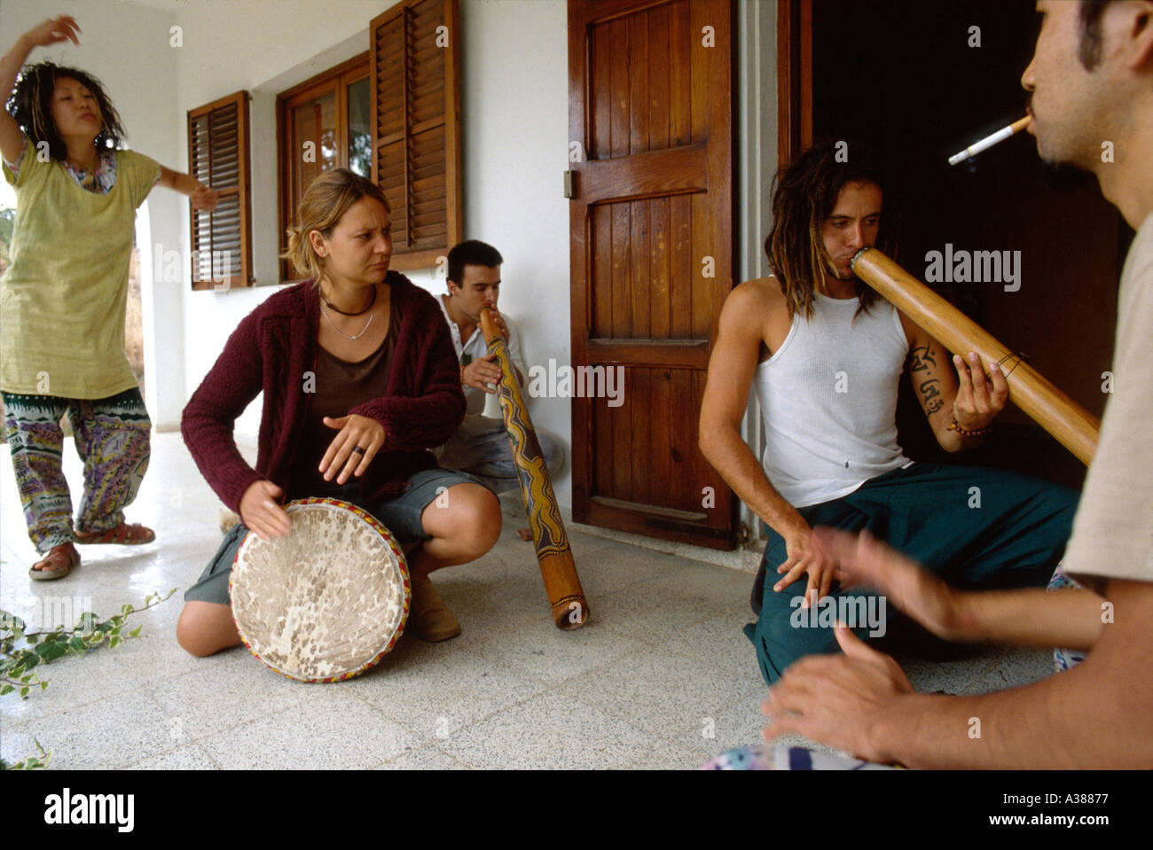 Friends Playing World Music At Home Before A Beach Party