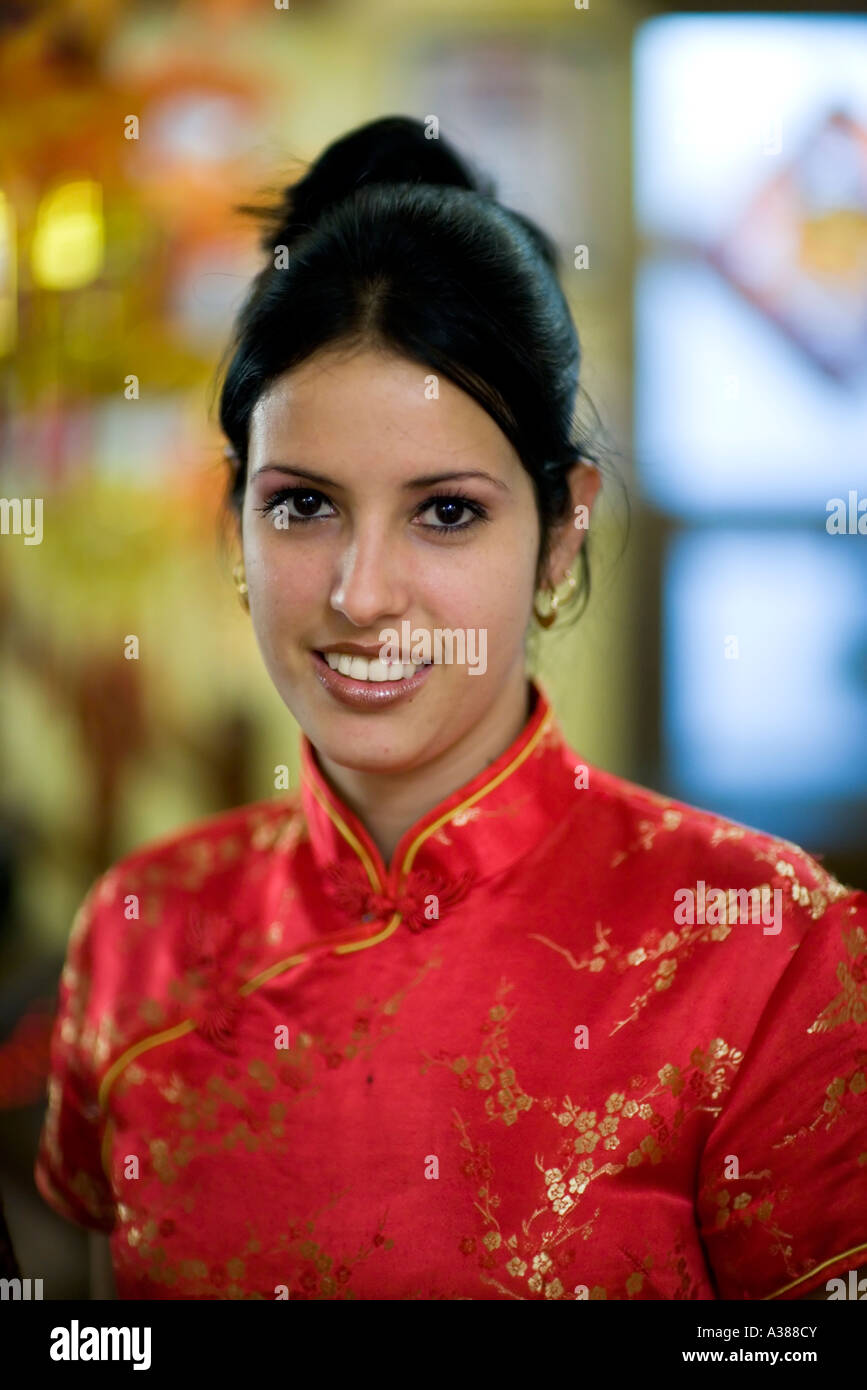 A Chinese Cuban waitress works at a Chinese restaurant in Barrio Chino Stock Photo