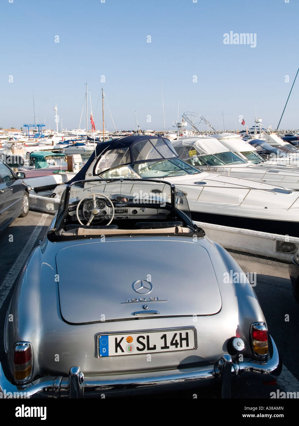 Classic German sports car Mercedes 190SL in front of the yacht harbour at Puerto  Banus Marbella Andalusia Spain Stock Photo - Alamy