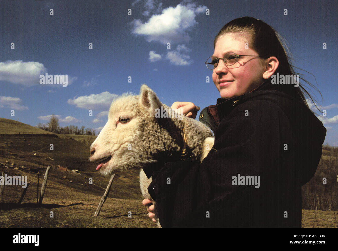 girl holding baby lamb Stock Photo - Alamy