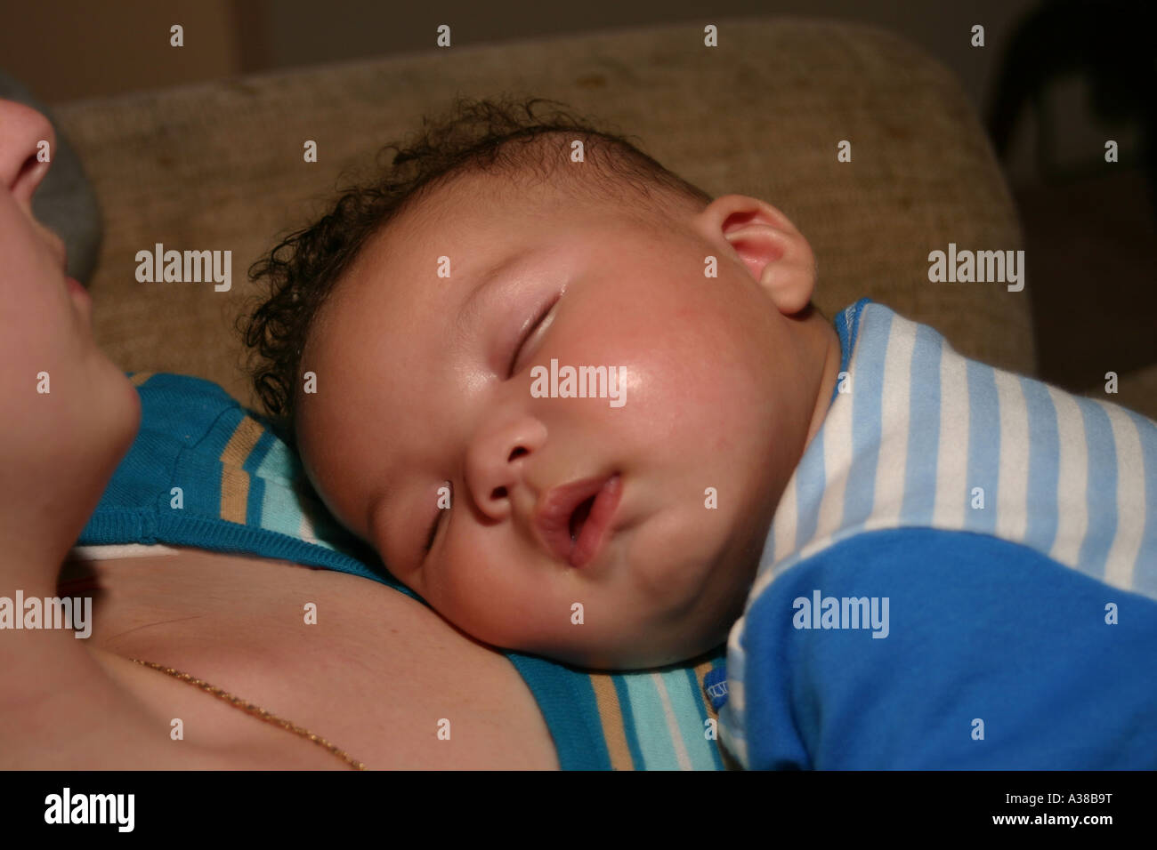 Baby sleeping on mom chest hires stock photography and images Alamy