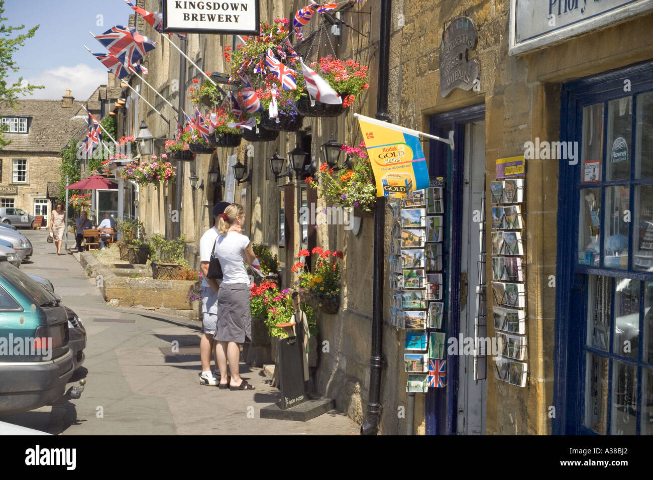 Shopping in the Market Square at the Cotswold town of Stow on the Wold