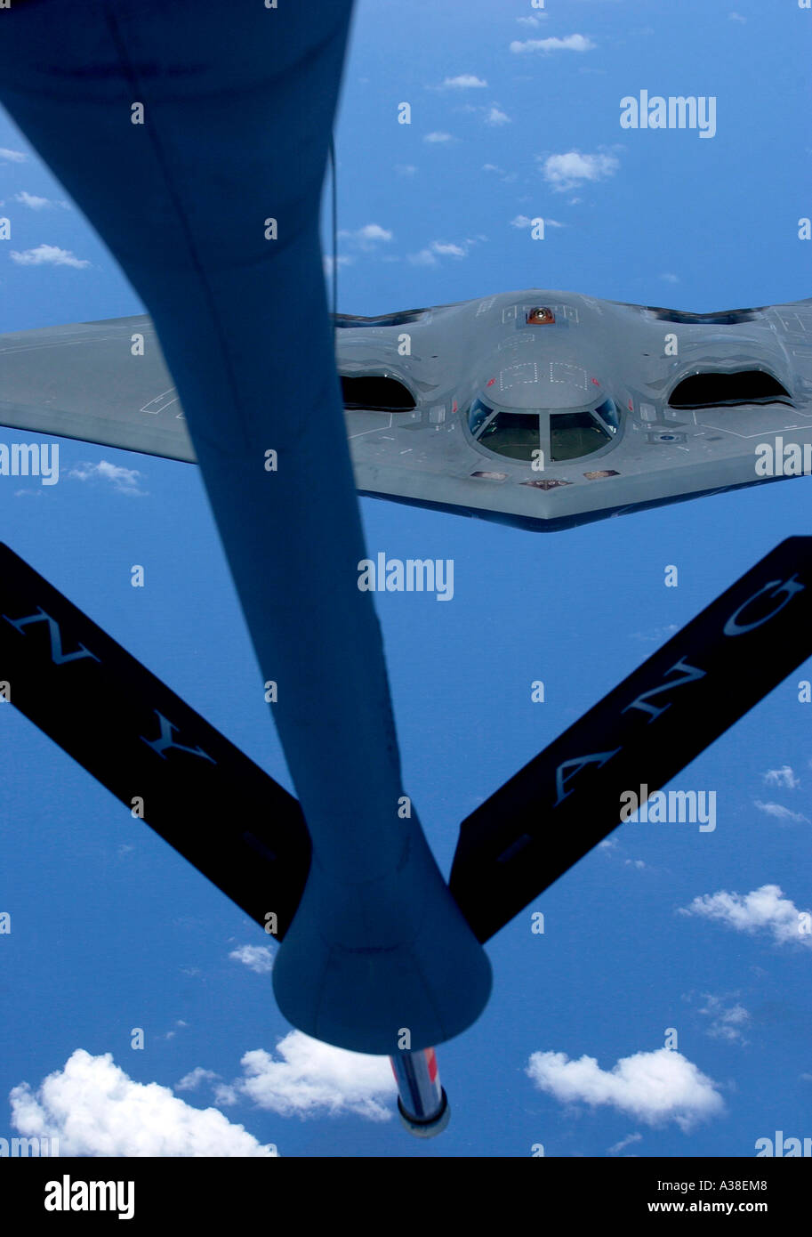 B2 Spirit bomber maneuvers toward a refueling boom as it prepares for a refueling mission Stock Photo
