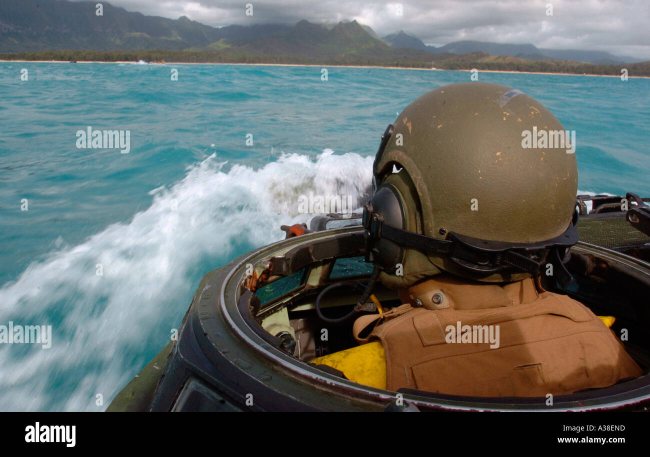 USA marine driving amphibious assault vehicle towards beach Stock Photo