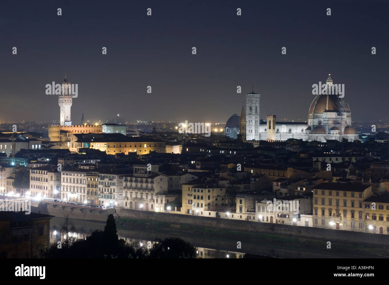 A night time cityscape view of Florence - NB Palazzo Vecchio tower left and the Basilica di Santa Maria del Fiore right. Stock Photo