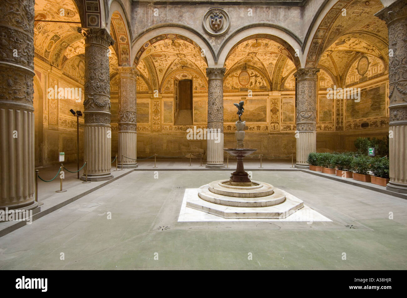 The ornate first courtyard at the entrance of the Palazzo Vecchio with the Putto fountain at the centre. Stock Photo