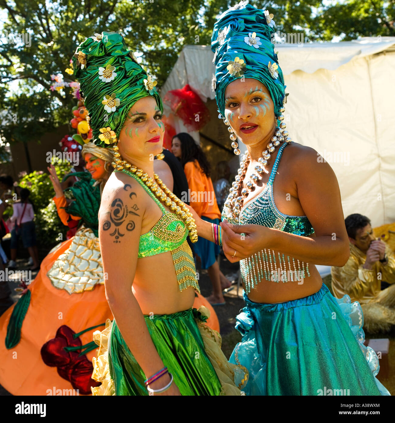 Two women dressed up in exotic bright clothes for a street carnival South Bank London England UK 2006 Stock Photo