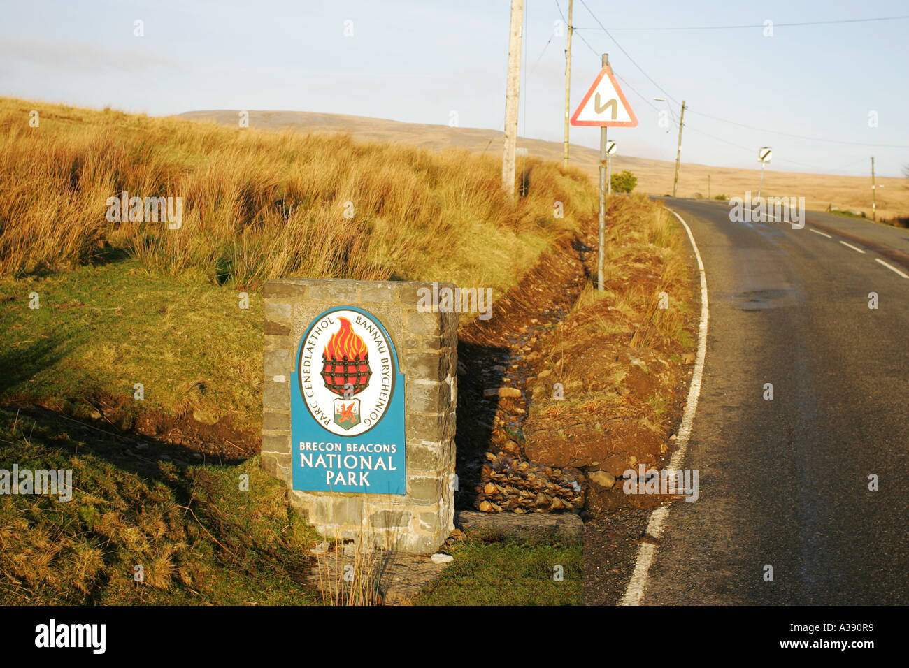 Stone sign shows the entrance to the Brecon Beacons National Park on a small rural road, Brynaman Mid Wales UK GB Stock Photo