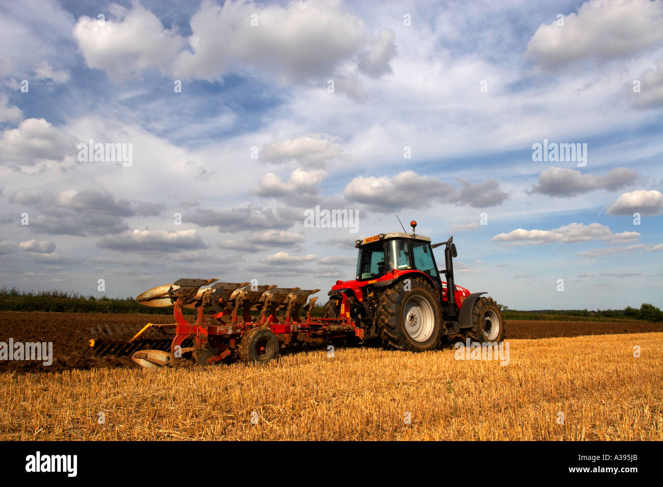 Tractor and Plough Stock Photo - Alamy