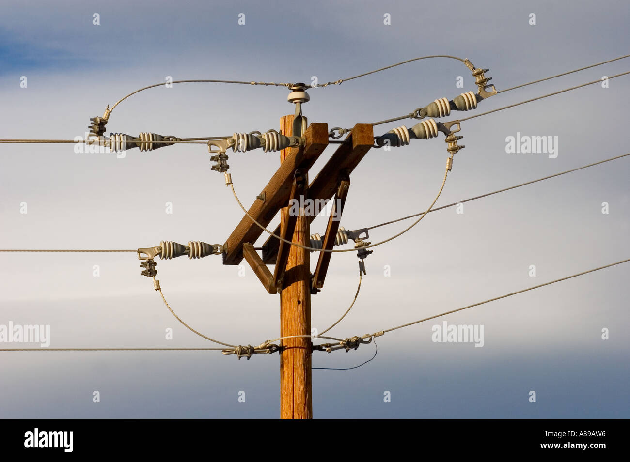 Utility pole against cool blue sky Stock Photo - Alamy