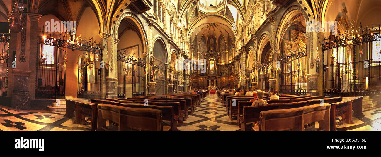 Cathedral Montserrat Mountain Basilica, church interior Architecture Interior with people Praying in Church Stock Photo