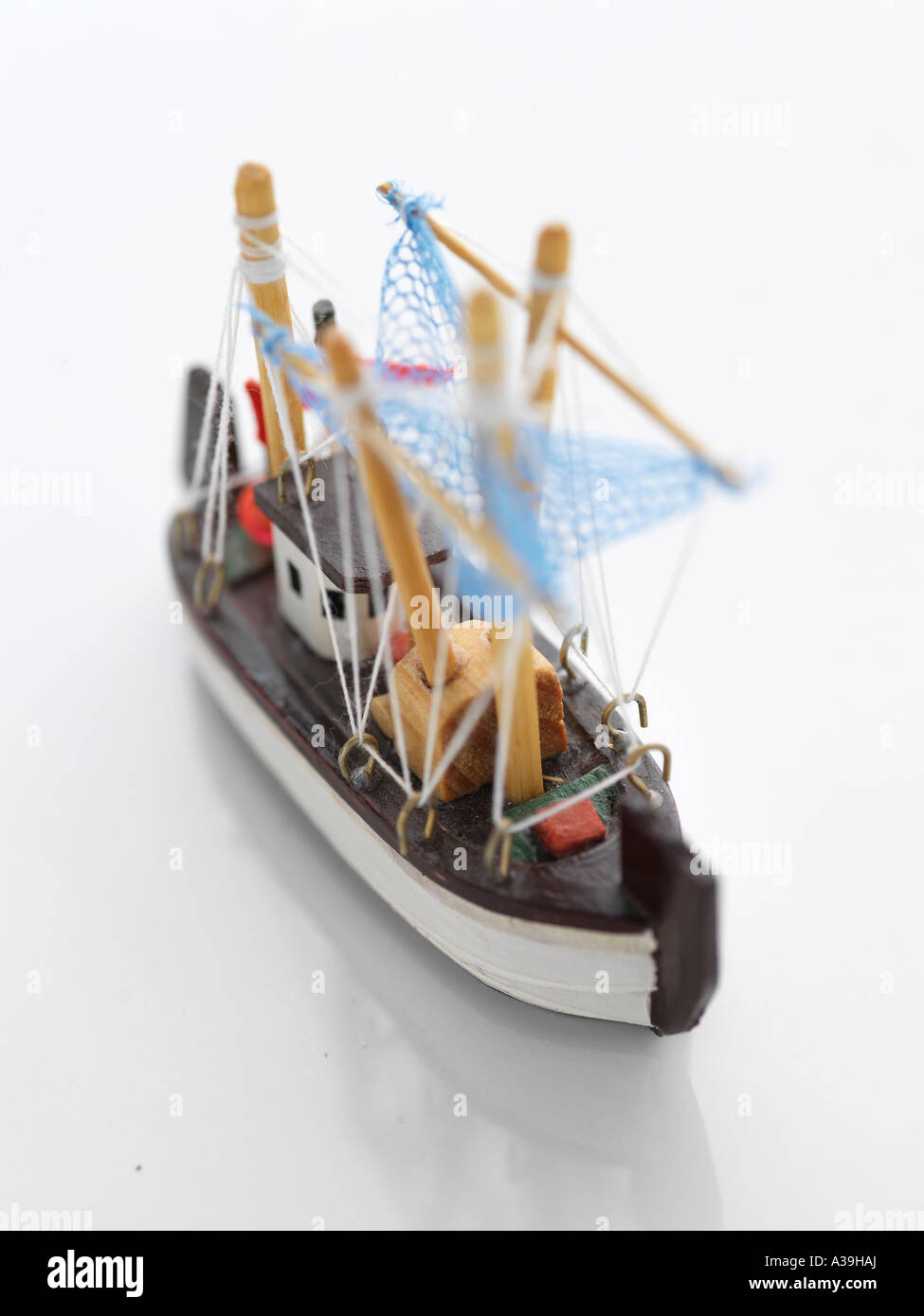 model, ship, ornament, wood, handicraft, souvenir, small, toy, detailed,  miniature, water, ocean, fishing, net, boat, vertical Stock Photo - Alamy