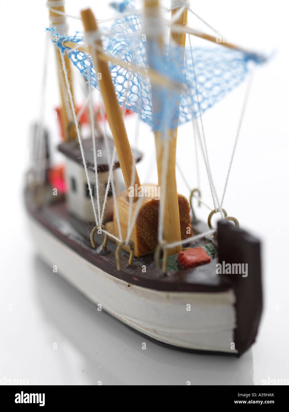 model, ship, ornament, wood, handicraft, souvenir, small, toy, detailed,  miniature, water, ocean, fishing, net, boat, vertical Stock Photo - Alamy