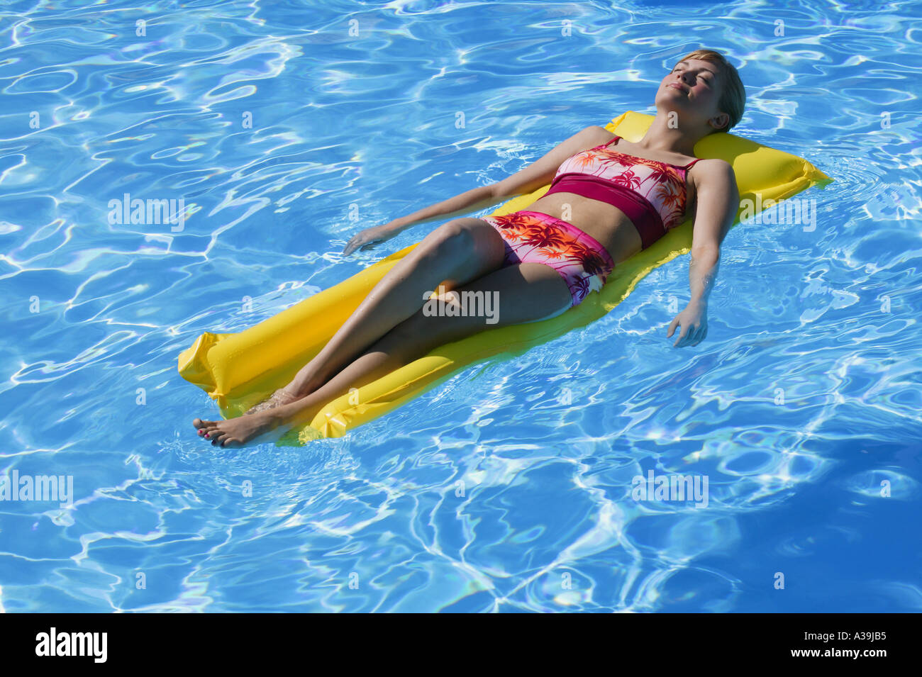 Woman sun tanning Stock Photo