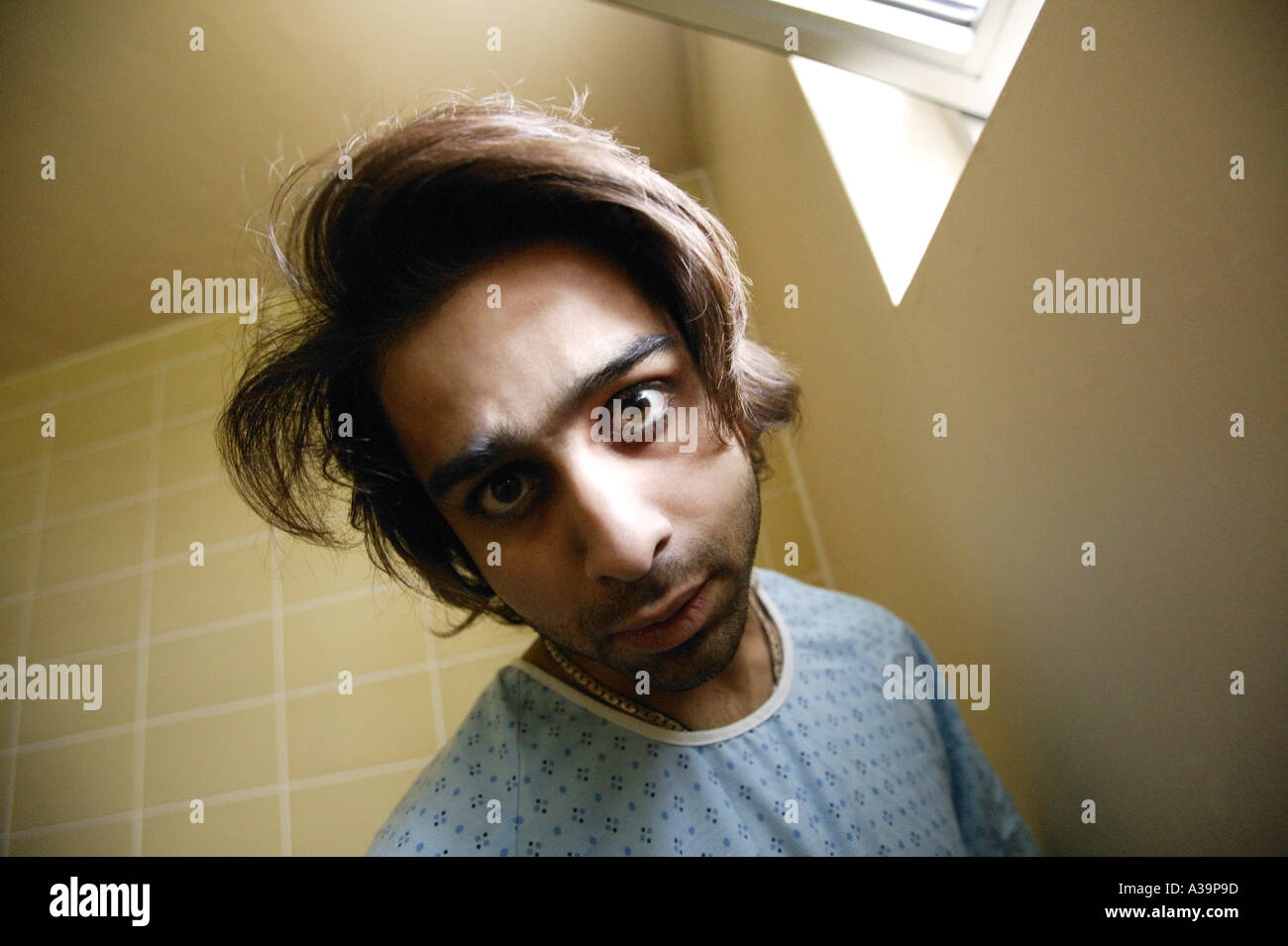 Man in hospital gown Stock Photo - Alamy