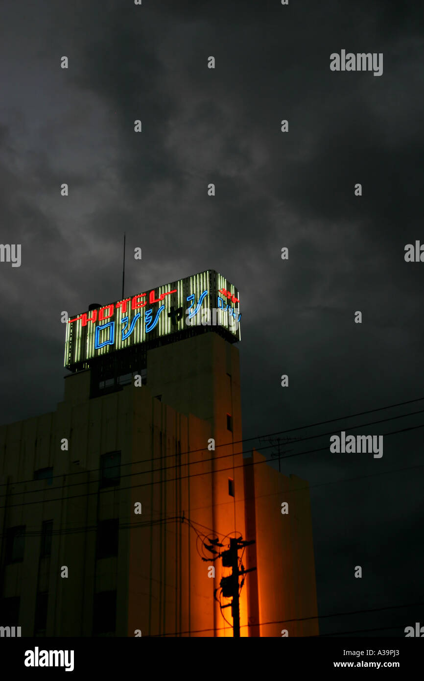 Love hotel lit up dramatically in the late evening with cloudy sky, Aomori City Stock Photo