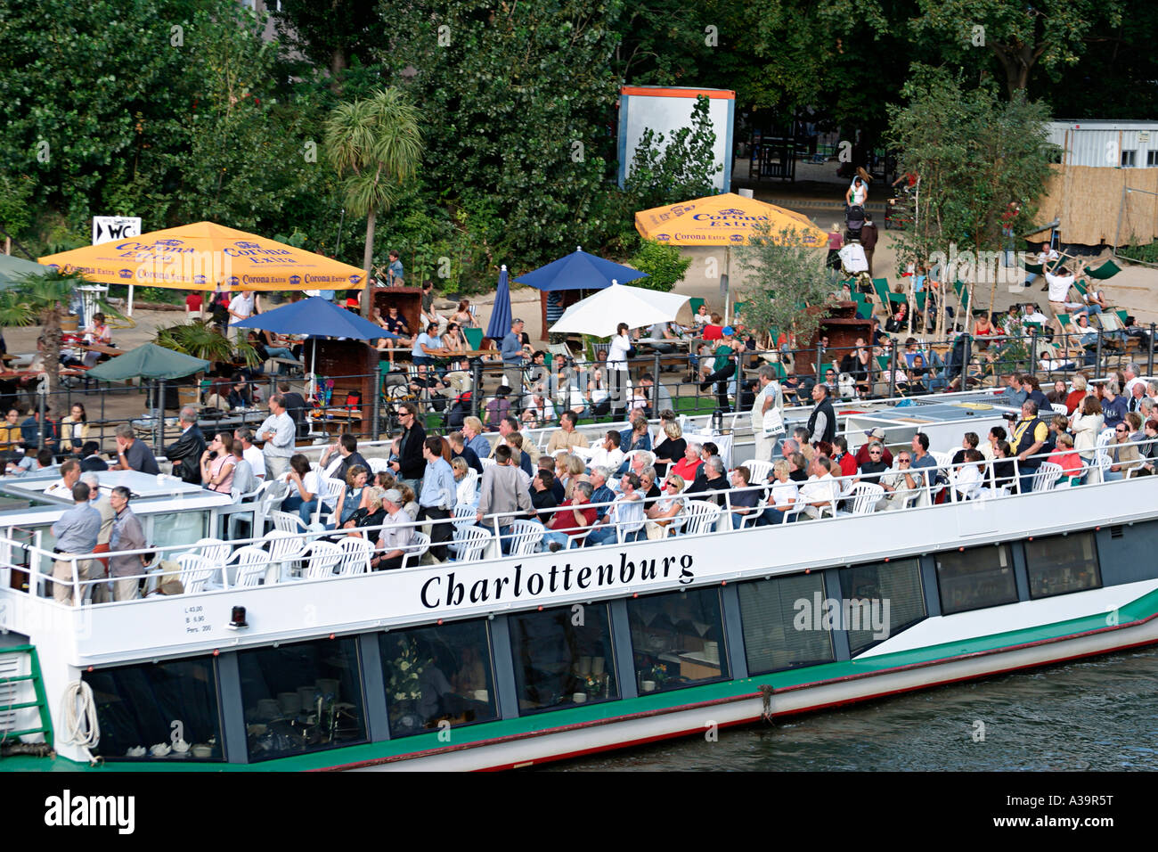 Berlin beach bar Spree toruist boat Berlin Spree Strandbar Mitte Ausflugsdampfer auf der Spree Stock Photo