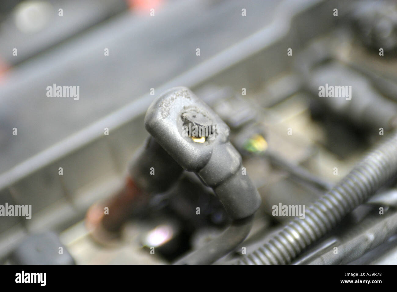 Damaged spark plug lead and insulation damage Alfa Romeo 156 1 8 twinspark engine Stock Photo