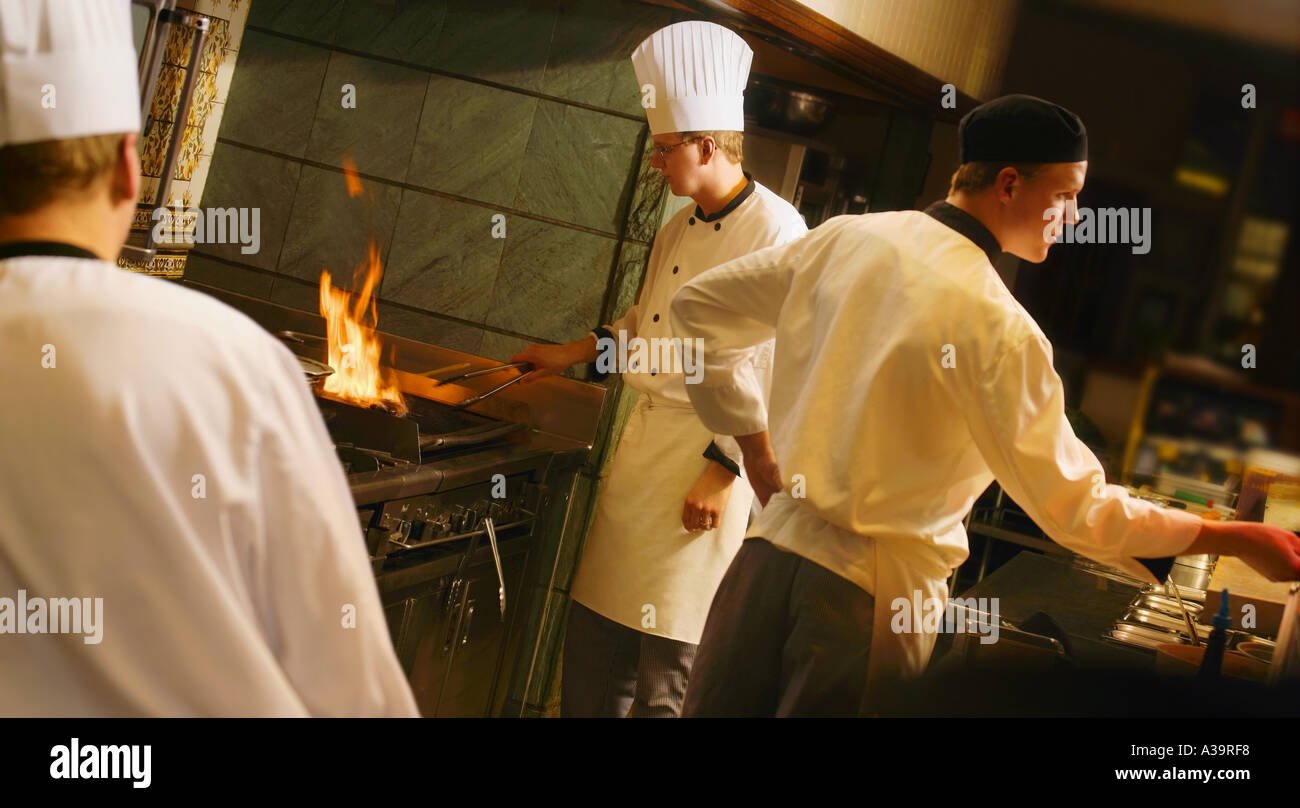 Chefs and cooks at work Stock Photo