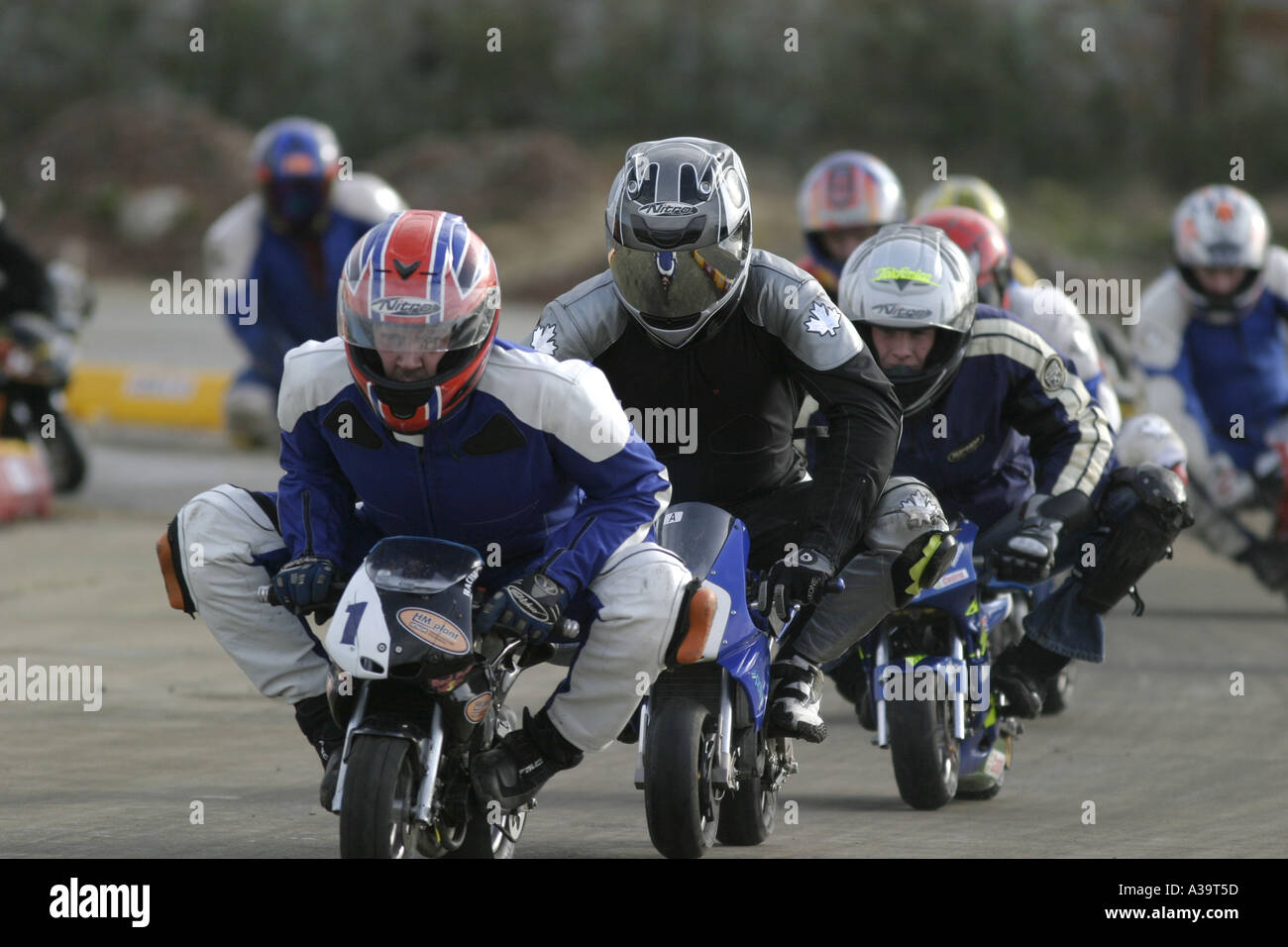 Senior minibike competitors at demonstration Motorcycle and motorsport show Titanic Quarter Belfast Northern Ireland Stock Photo